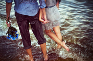 Prenuptial Agreement Attorney In Illinois- couple on beach holding hands